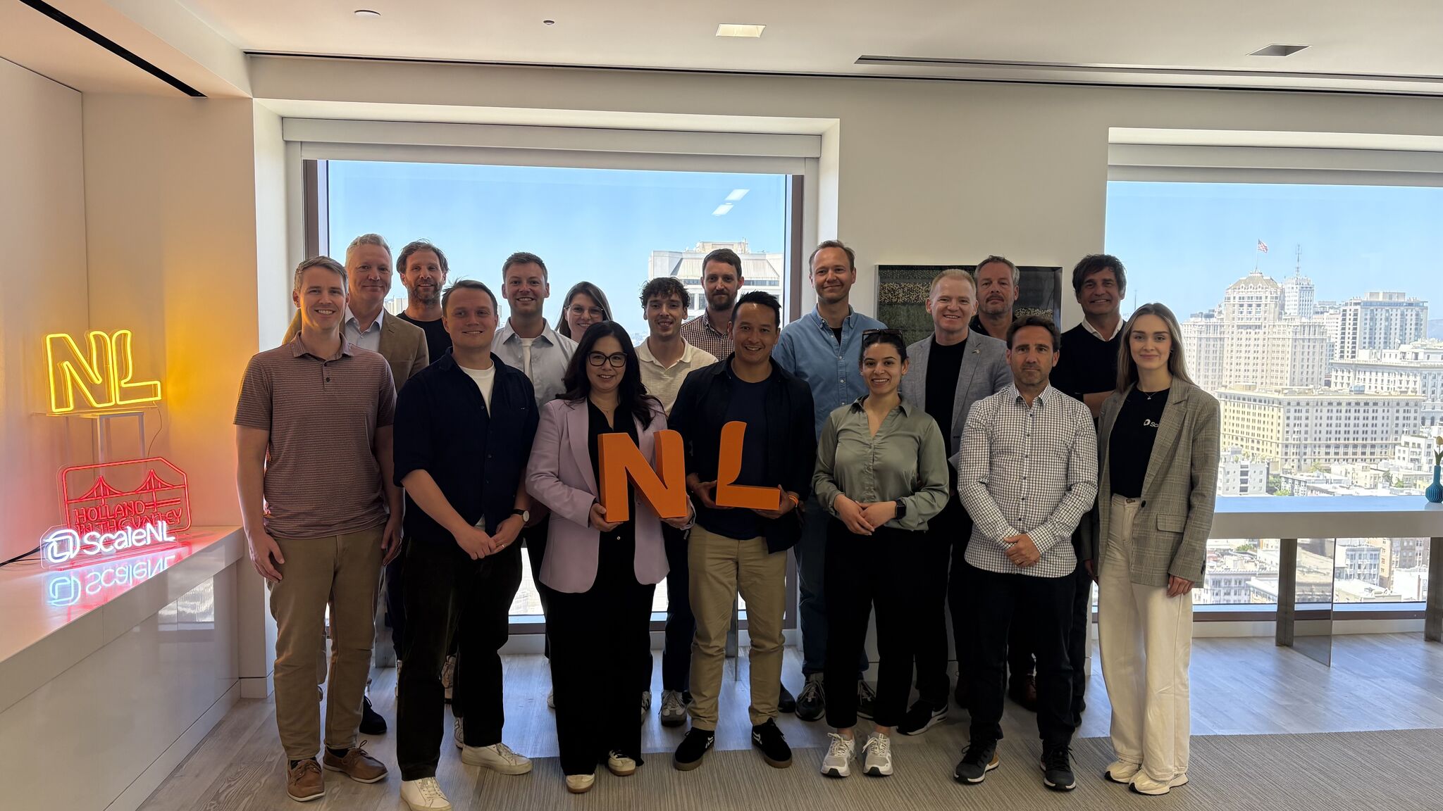 Founders and program team group photo in a skyscraper building