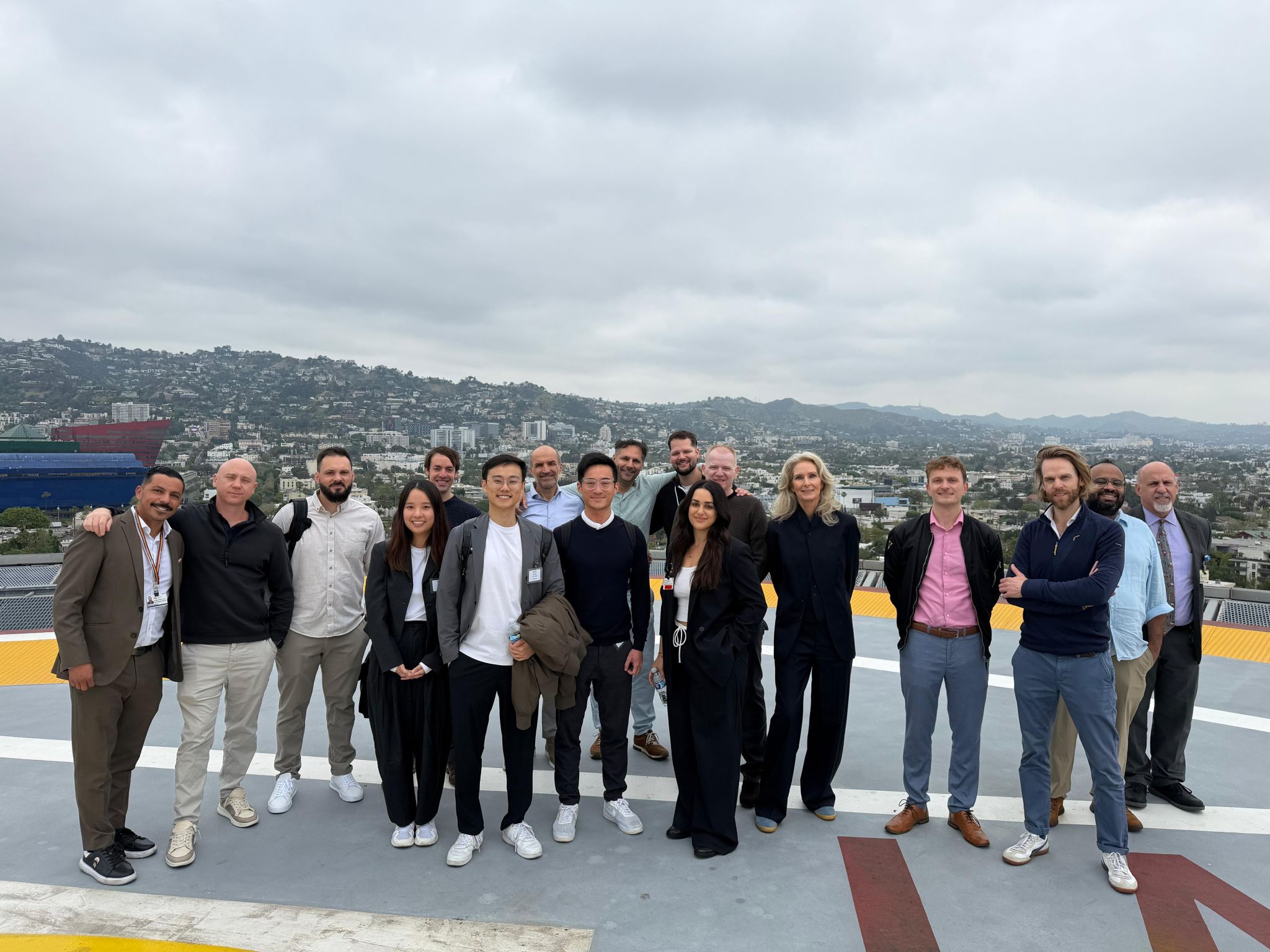 Group of people standing on a helipad